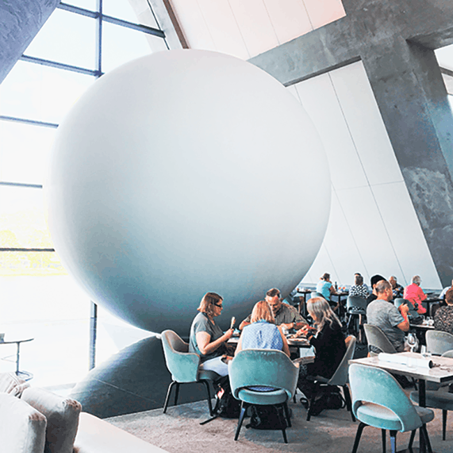 image shows a spherical art installation located in a rastaurant. The image was taken at MONA Tasmania.