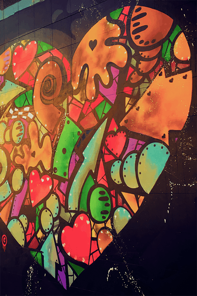 Image shows a brightly coloured graffiti heart above the text "Plus Size Travel Resources"
