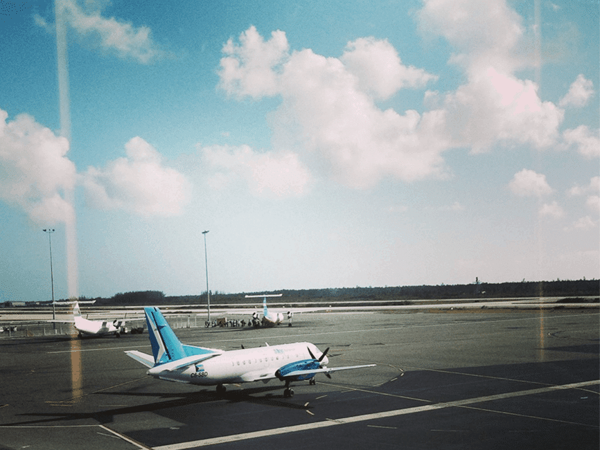 Image of a white airplane taxiing under a cloud fiolled sky sits above the text "Find cheap flights: do's and don'ts"